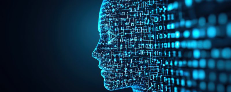 Illustratie van een digitaal menselijk gezicht opgebouwd uit blauwe datapunten en binaire code, als symbool voor kunstmatige intelligentie, data en privacy.